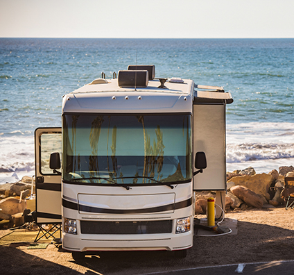 RV parked next to the coast